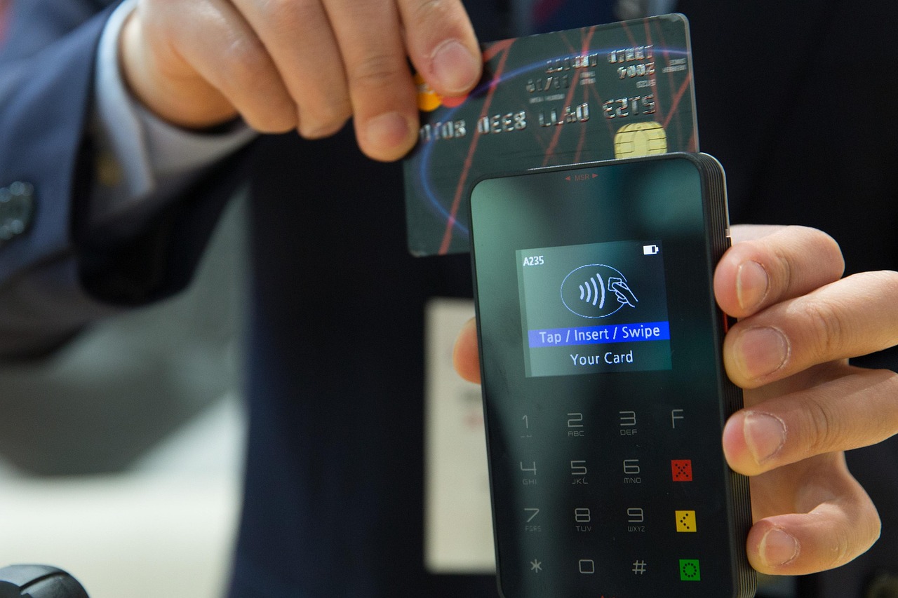 cashier using pos terminal